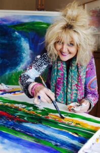 Well known local Welsh artist Jan Gardner seen in her studio