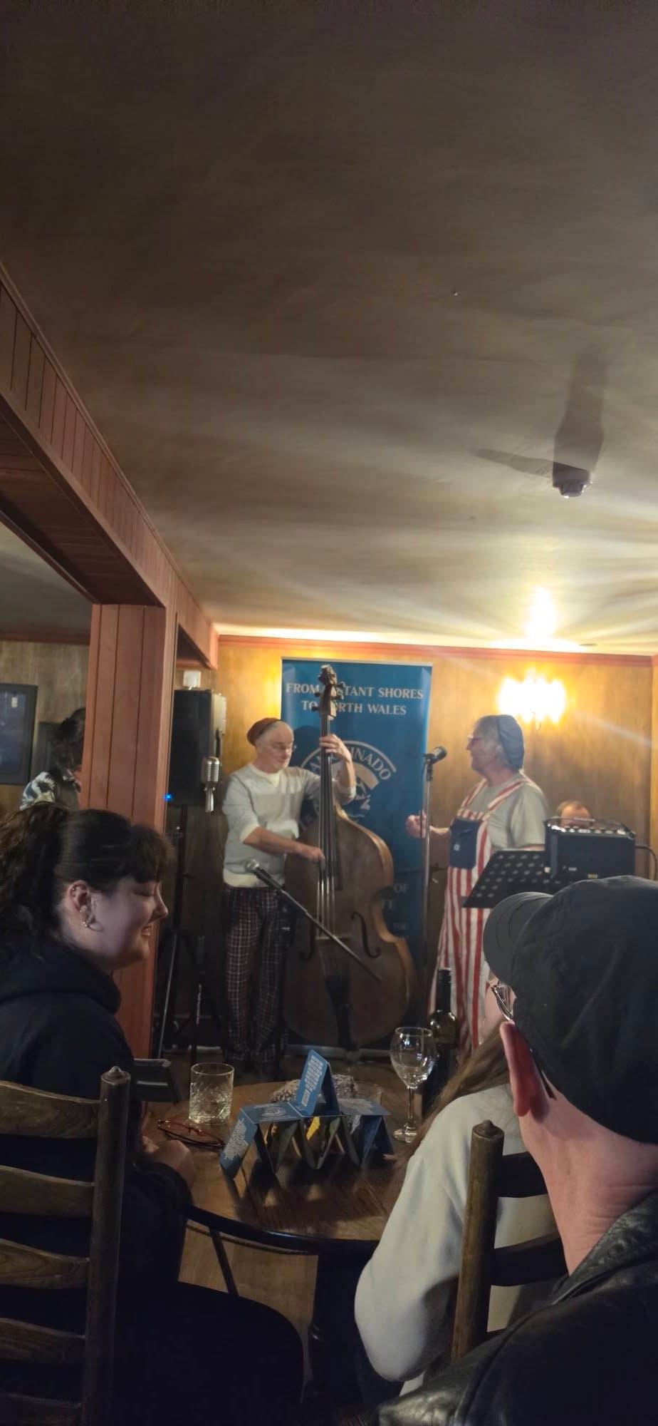 snapshot of the basement bar with musicians playing