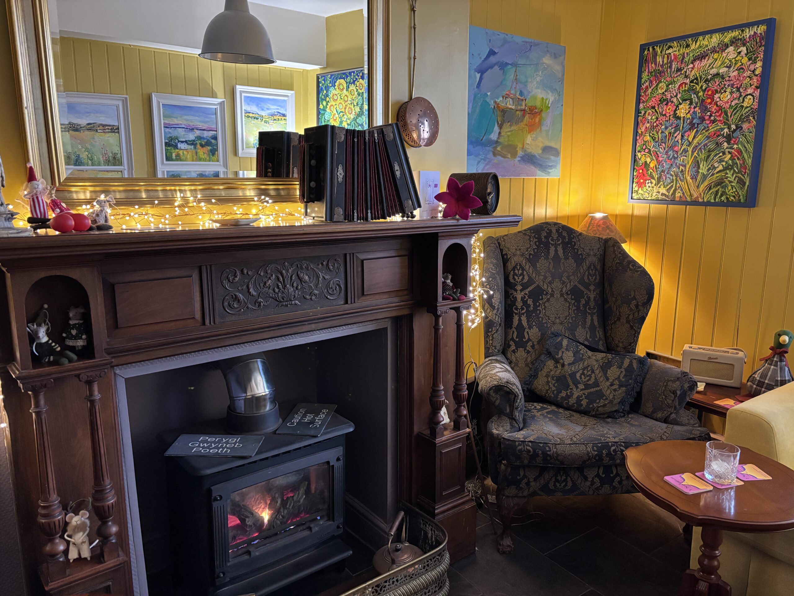Picture capturing an original Georgian fireplace with wing chair