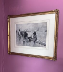 watercolour grisaille painting in gold frame on the wall against a rose pink background