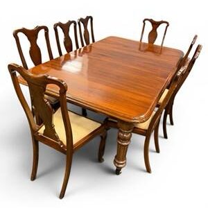 vintage dining table that can extend with eight chairs