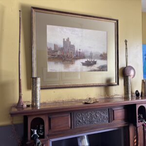 picture of a castle over the mantlepiece