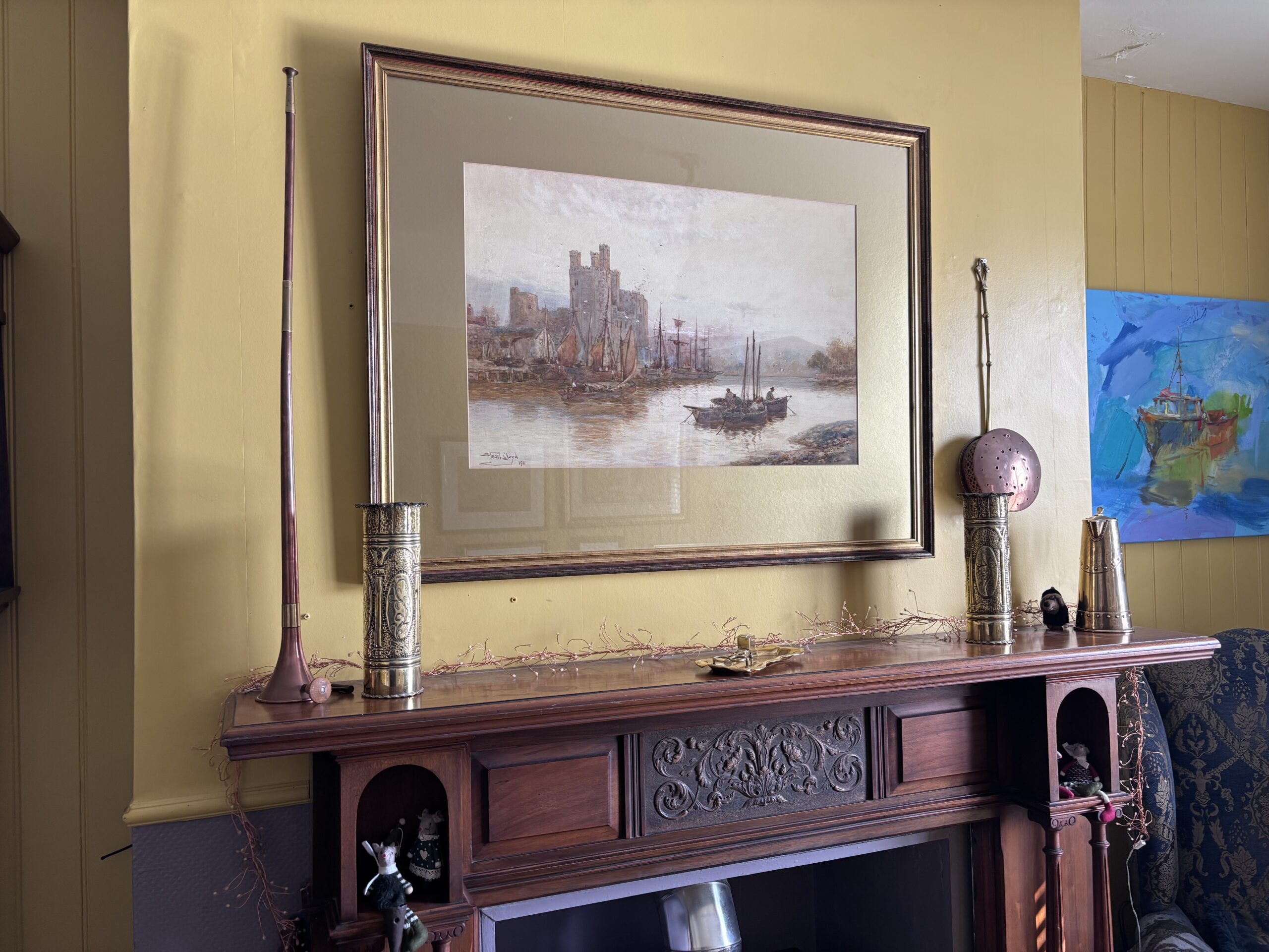 picture of a castle over the mantlepiece