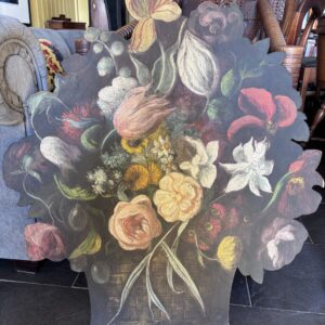 a wooden panel shaped like a bouquet of flowers and painted in colourful floral display