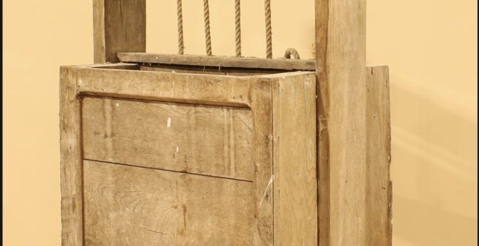 an antique piece of social history in the form of a rustic cheese press