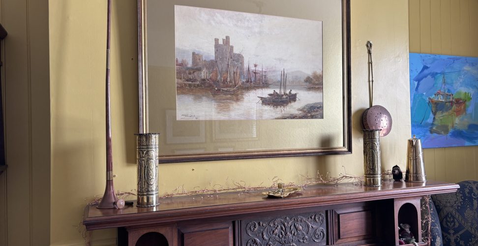 picture of a castle over the mantlepiece