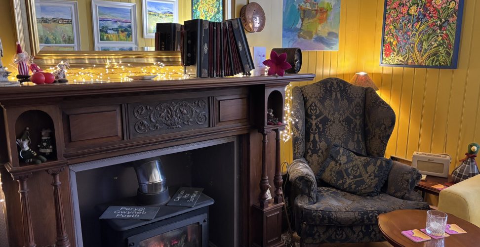 Picture capturing an original Georgian fireplace with wing chair