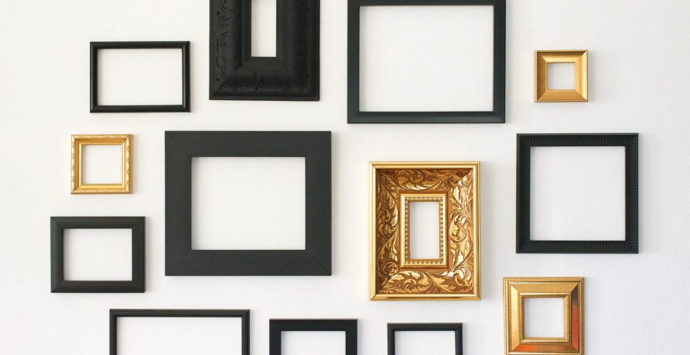 Multiple,Many,Blank,Small,Picture,Frames,On,White,Wall